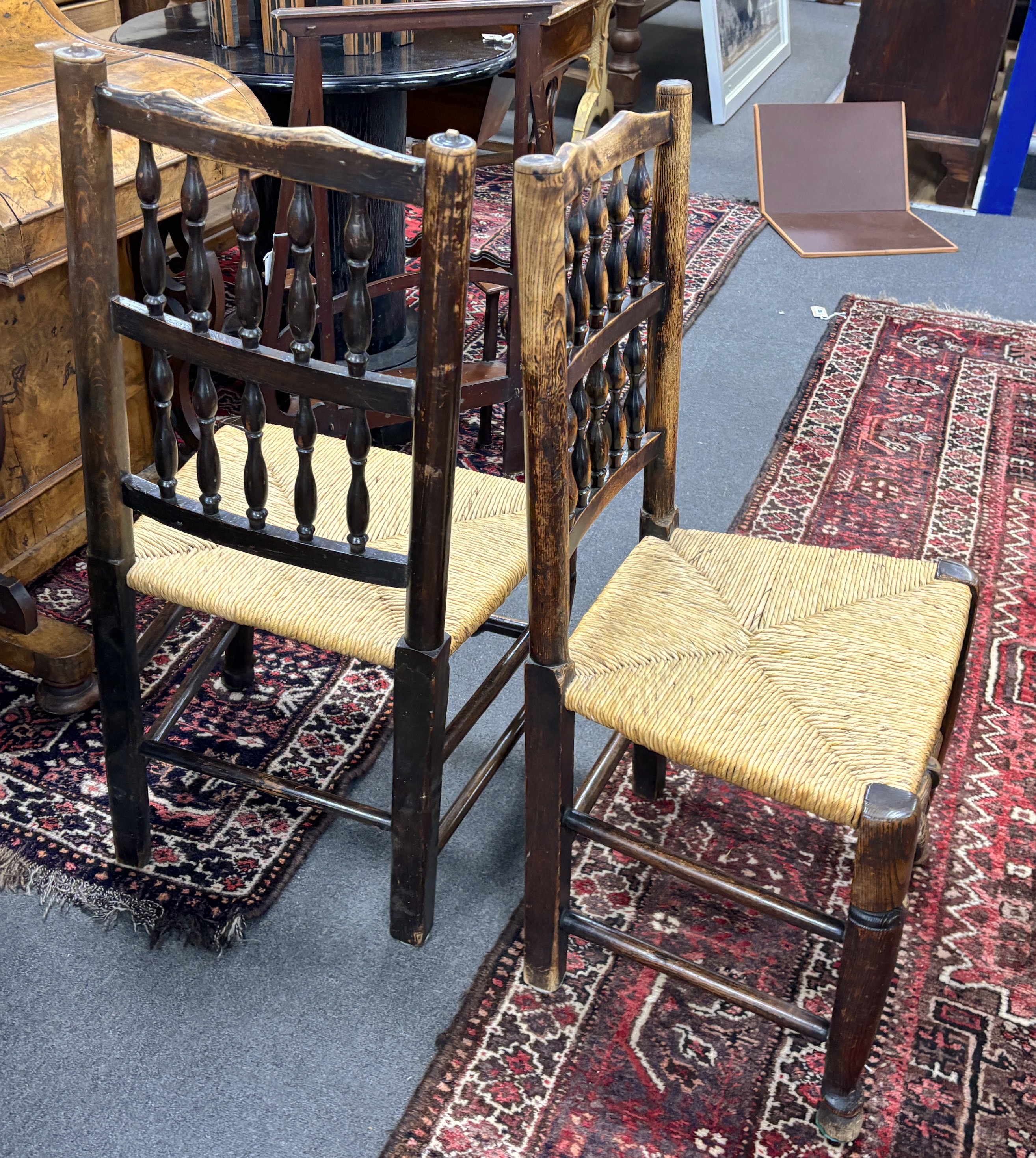 A set of four Lancashire ash and beech rush seat dining chairs